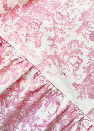 Pink floral toile de jouy pattern fabric with ruffled edge