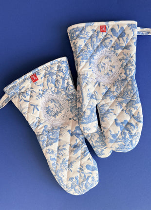 Pair of blue toile de jouy patterned oven mitts with royal emblem embroidery