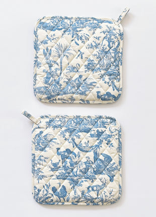 Pair of blue toile de jouy patterned pot holders with royal emblem embroidery 