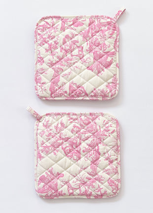 Pair of pink toile de jouy patterned pot holders with royal emblem embroidery 